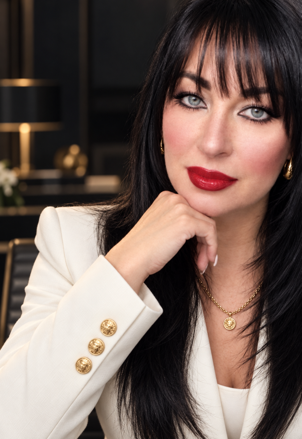 Victoria Beale, founder of Victorious Global Agency, wearing an ivory jacket with gold styling